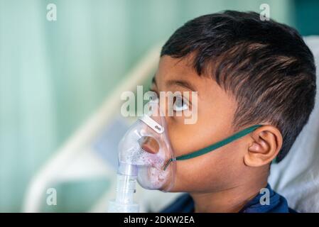 Boy Wearing Nebulizer At Hospital