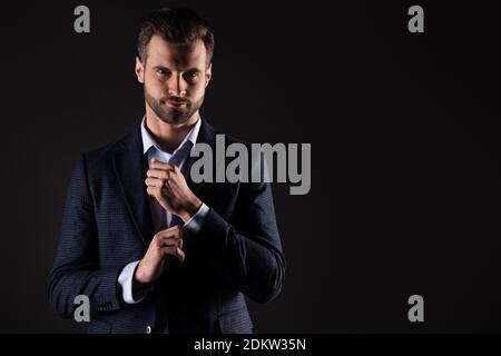 Portrait of his he nice attractive luxury imposing elegant perfect rich wealthy fashionable brandy trendy guy corporate partner fastening button Stock Photo