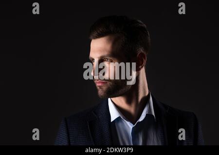 Close-up portrait of his he nice attractive content chic classy corporate employee man banker agent broker financier wearing jacket isolated over dark Stock Photo