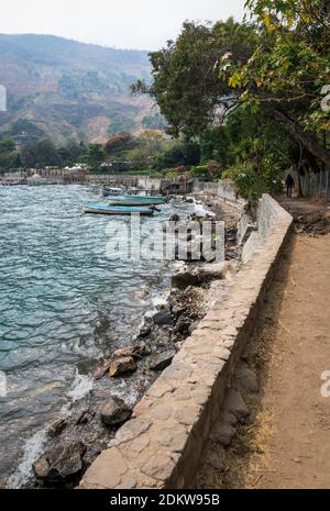 Pathway and wooden docks along lake Atitlan at the coast of Santa Cruz la Laguna, Guatemala Stock Photo