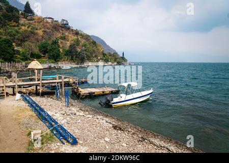 Wooden swimming dock along lake Atitlan at the coast of Santa Cruz la Laguna, Guatemala Stock Photo