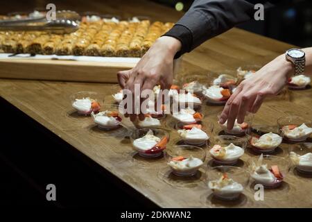 Individual cocktail salad servings on a buffet table Stock Photo