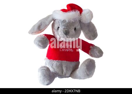 My First Christmas soft plush toy bunny rabbit wearing Santa hat and Christmas jumper isolated on white background Stock Photo