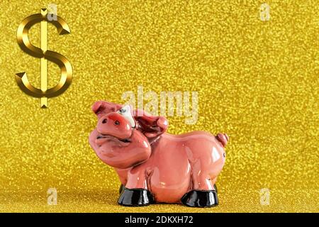 Piggy bank-pig on a gold background with a dollar sign. Keeping money and investment concept Stock Photo