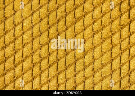 Texture of genuine leather close-up, embossed with reptile scales, modern trendy background Stock Photo