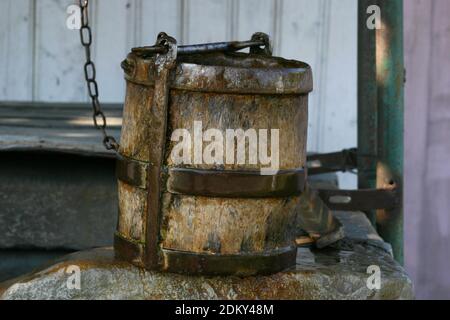 Vrancea County, Romania. Authentic water well with wheel and wooden bucket. Stock Photo