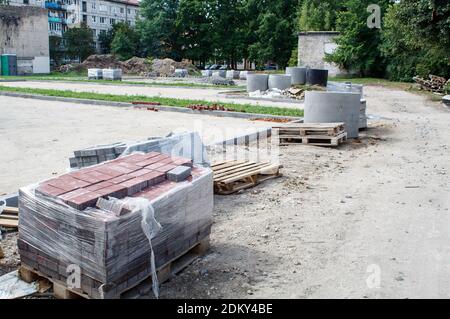 stacks of paving slabs prepared for laying outdoor on sunny summer day Stock Photo