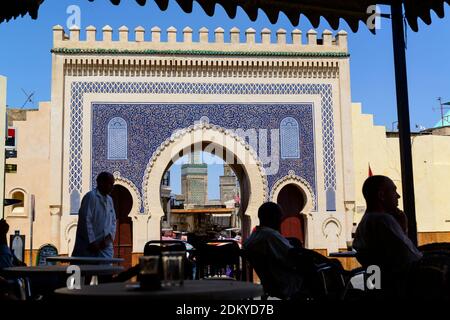 The gate Bab Bou Jeloud leads into the old medina in Fes, Morocco. It is also known as The Blue Gate to Fes. View from the terrace of a teahouse Stock Photo