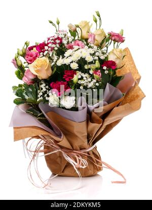 Lovely bouquet with different kind of flowers wrapped in kraft paper isolated on white. Stock Photo