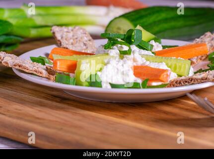 healthy snack with vegetables, cottage cheese and crispbread Stock Photo