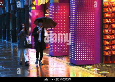 Westminster, London, UK. 16 Dec, 2020. UK Weather: Chilly and drizzly rain in the West End in London. People walking around with umbrellas. Photo Credit: PAL Media/Alamy Live News