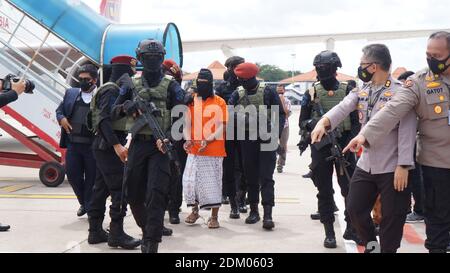 Tangerang, Indonesia. 16th Dec, 2020. Police escort 57-year-old Zulkarnaen, a senior leader of the Al-Qaeda-linked Jemaah Islamiyah (JI), who had been on the run for his alleged role in the 2002 Bali bombings, upon arrival at Jakartas Soekarno-Hatta International Airport. (Photo by Fajrin Raharjo/Pacific Press) Credit: Pacific Press Media Production Corp./Ģ����ý Live News Stock Photo