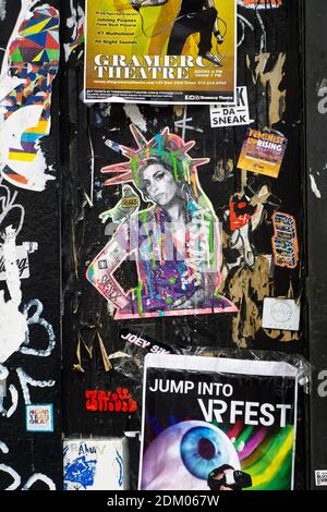 A collage of stickers, posters2017, urban art,  and graffiti on a wall on Orchard Street on the Lower East Side of Manhattan, New York City. Stock Photo