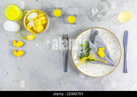 Ultimate Gray and Illuminating colors aesthetic elegant fine Easter events table place setting overhead. Top view creative composition flat lay. Stock Photo