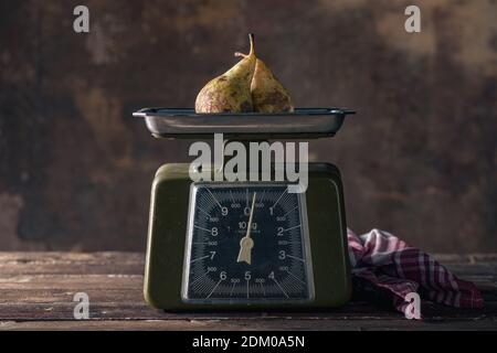 Vintage Scales on Wooden Table with Pears Stock Photo