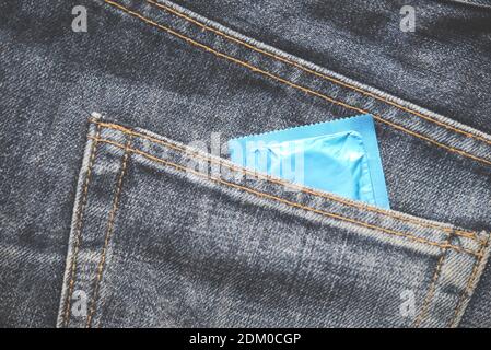 Condom in the blue jeans pocket Stock Photo - Alamy