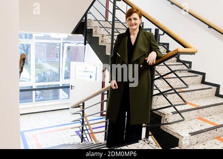 Flensburg, Germany. 15th Dec, 2020. A sign reading "Impfzentrum Flensburg" stands in front a building belonging to the Bundesanstalt für Immobilienaufgaben (BImA). Mayor Lange came to inspect and hand over the
