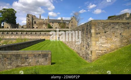 A view toward the medieval stone castle building in the Fife coastal village of Aberdour in Scotland Stock Photo