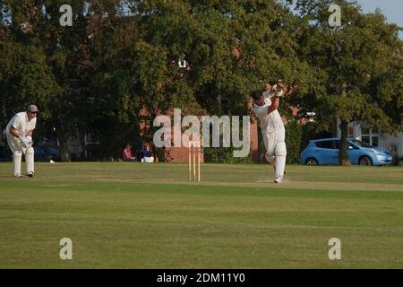 Village cricket in England with a focus on the batsman and wicket keeper Stock Photo