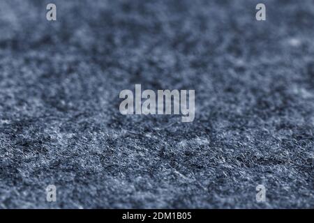 Closeup artificial grey felt background. Angle view. Shallow focus. Stock Photo