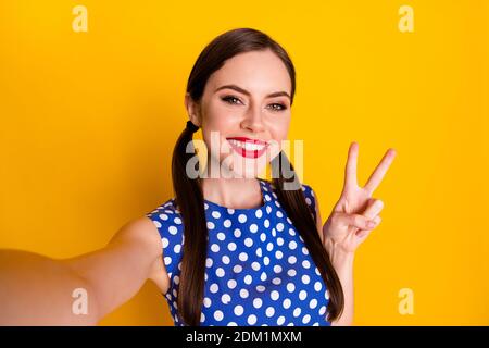 Self-portrait of her she nice-looking attractive pretty cute winsome glamorous cheerful cheery girl showing v-sign isolated on bright vivid shine Stock Photo