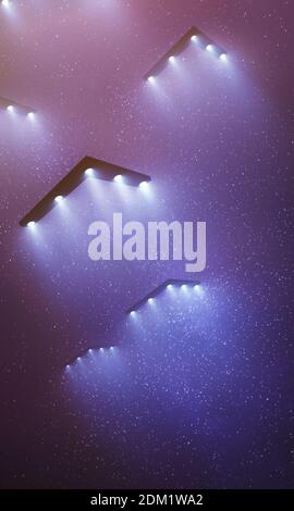 Unidentified flying object at night with fog and a light below. Triangular UFO, 3D illustration. Stock Photo