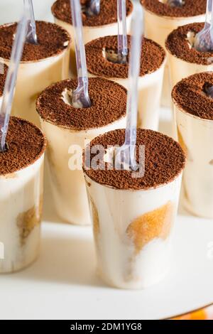 Thr portions of appetizing tiramisu at the party Stock Photo