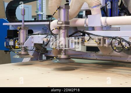 Machine tools format cutting are cut chipboard furniture in the shop. Industry Stock Photo