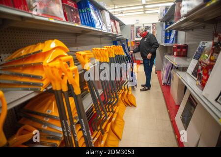 Southampton, Pennsylvania, UK. 16th December, 2020. Andy Ross of Huntingdon Valley chooses a shovel in preparation for a major snowstorm in the Northeast Wednesday, December 16, 2020 at Ace Hardware in Upper Southampton, Pennsylvania. Credit: William Thomas Cain/Alamy Live News Stock Photo