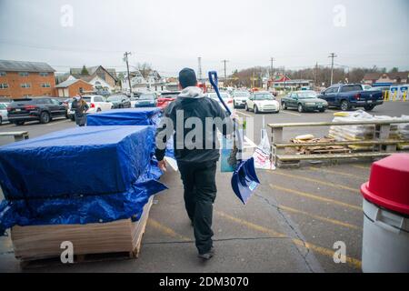 Southampton, Pennsylvania, UK. 16th December, 2020. A customer who declined to identify himself carries a shovel in preparation for a major snowstorm in the Northeast Wednesday, December 16, 2020 at Ace Hardware in Upper Southampton, Pennsylvania. Credit: William Thomas Cain/Alamy Live News Stock Photo