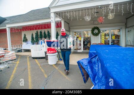 Southampton, Pennsylvania, UK. 16th December, 2020. Andy Ross of Huntingdon Valley carries a shovel and rock salt in preparation for a major snowstorm in the Northeast Wednesday, December 16, 2020 at Ace Hardware in Upper Southampton, Pennsylvania. Credit: William Thomas Cain/Alamy Live News Stock Photo