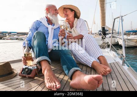 Couple Toasting Drinks While Sitting On Boat