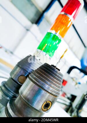 General view of a CNC machine cutting through a Polyethylene board in a plastic manufacturing factory. Stock Photo