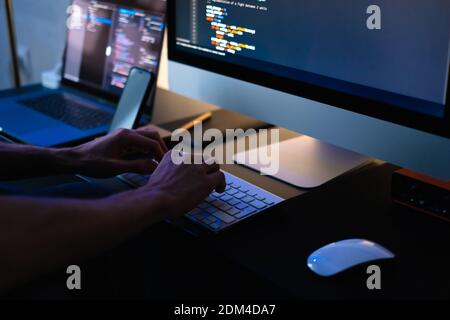 Mobile developer writes program code on a computer. High quality photo Stock Photo
