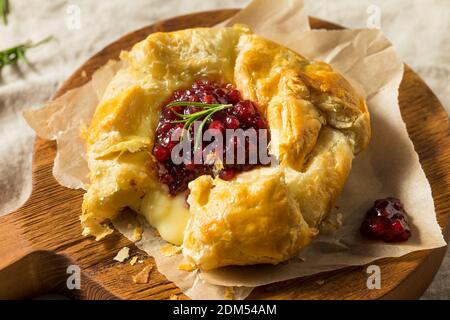Homemade Baked Brie in Puff Pastry with Lingonberry Stock Photo