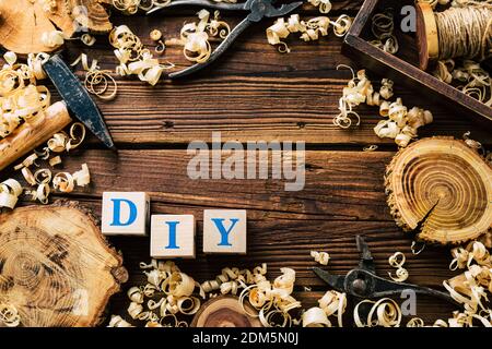 Do it Yourself wood. Woodworking workshop. DIY. Wood shavings and carpentry tools. Copy Space Stock Photo