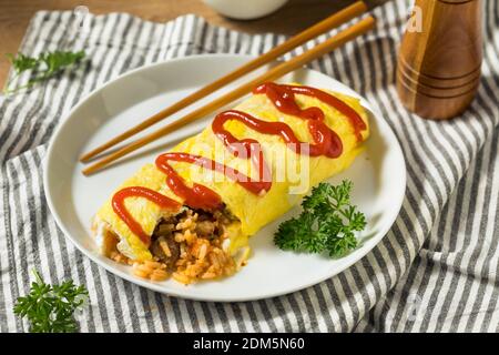 Homemade Japanese Omurice Rice Omelet with Ketchup Stock Photo