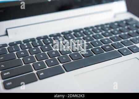 Black and white qwerty keyboard on modern laptop computer Stock Photo