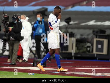 Crystal Palace's Christian Benteke walks off after being sent off during the Premier League match at the London Stadium. Stock Photo