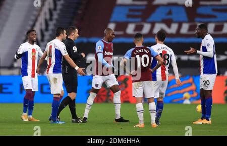 Crystal Palace's Christian Benteke (right) is sent off for a second bookable offence during the Premier League match at the London Stadium. Stock Photo
