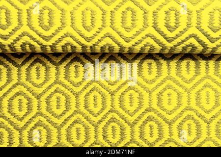 Bright IlluminatingYellow and Gray Wool Rug Carpet Texture Background. Concept of Color of the Year 2021 with bright illuminating yellow and gray colours. Top view, flat lay, copy space. Stock Photo