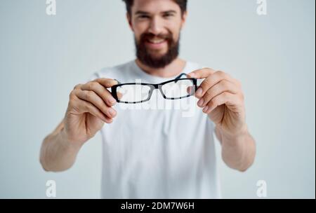 bearded man wearing glasses poor eyesight health problems treatment Studio Stock Photo