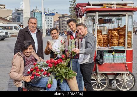 Group portrait of several young guys and one elderly man near stall with  turkish bagel at Taksim in Beyoglu, Istanbul Stock Photo - Alamy