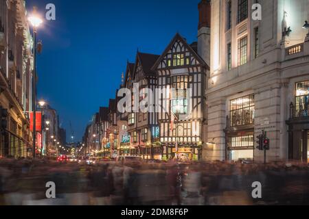 London, United Kingdom - December 13 2014: Hoards of Christmas shoppers at a crossing at Regent Street in front of Liberty London department store in Stock Photo