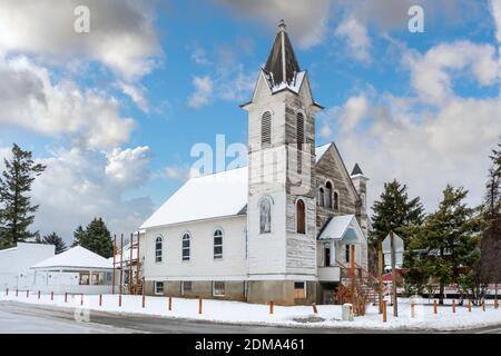 A turn of the century wooden church sits on a corner in the rural town of Spirit Lake, Idaho, USA Stock Photo