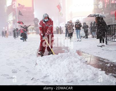 New York, United States. 16th Dec, 2020. Workers shovel snow while heavy snow continues to fall in Times Square in New York City on Wednesday, December 16, 2020. A winter storm nor'easter is set to possibly dump more than a foot of snow in parts of New York State and the Northeast. Photo by John Angelillo/UPI Credit: UPI/Alamy Live News Stock Photo