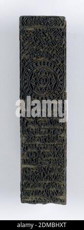 Printing block, Medium: wood Technique: carved in relief., Block for printing textiles with a design of writing. Contemporary picture hangers attached., India, 19th century, appliances & tools, Printing block Stock Photo