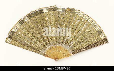 Pleated fan, Silk net leaf with applied metal foil and sequins, celluloid sticks inlaid with sequins; celluloid guards with copper and inlaid with metal foil; mother-of-pearl rivet, Pleated fan with a fine silk net leaf appliquéd with gold-colored metal foil and sequins in chevron pattern; reverse: plain. Celluloid sticks inlaid with sequins. Celluloid guards with copper and inlaid with gold-colored metal foil., Italy, 19th century, costume & accessories, Pleated fan Stock Photo