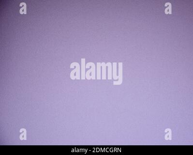 Monochrome rough surface in bright purple with a gradient and vignetting around the edges. Background, texture. Stock Photo