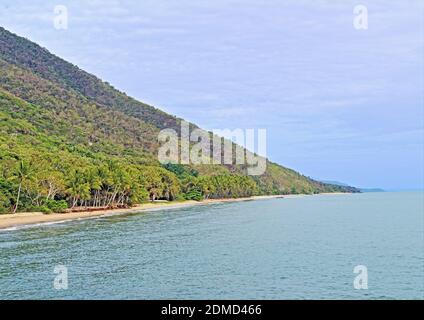 The onshore view to Ellis Beach where the rainforest meets the sea north of Cairns along Great Barrier Reef Drive as drive north towards Port Douglas Stock Photo